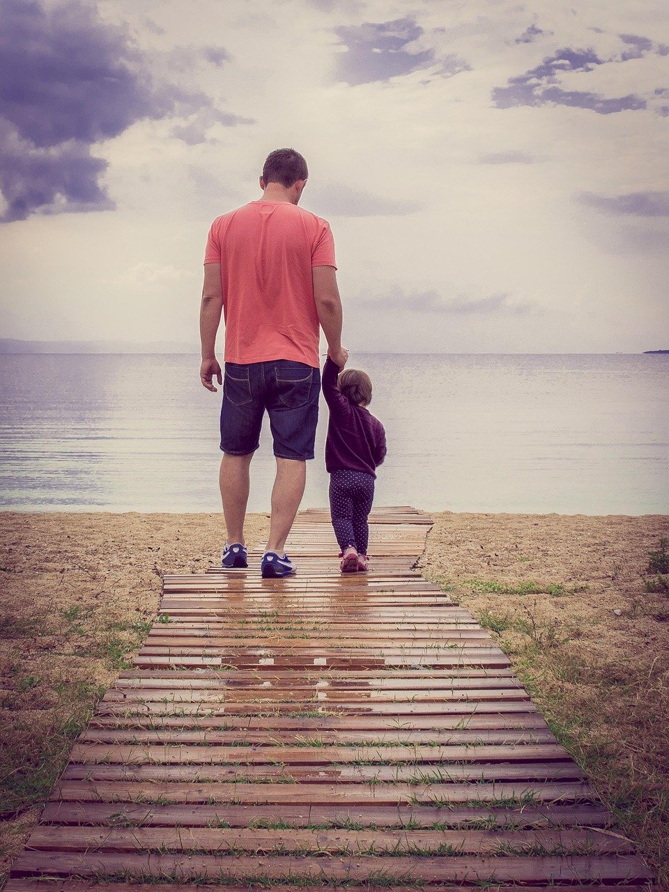 calm-father-smiling-with-children-at-home